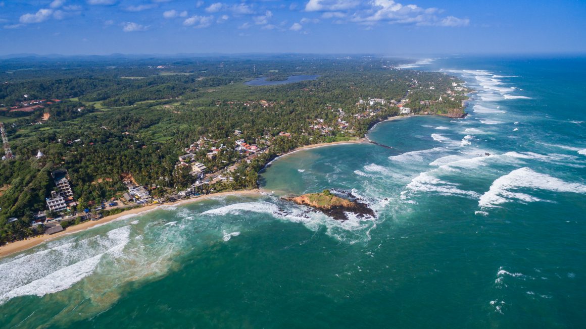 Mirissa Beach | Image Credit: By dronepicr (Mirissa beach aerial) [CC BY 2.0], via Wikimedia Commons